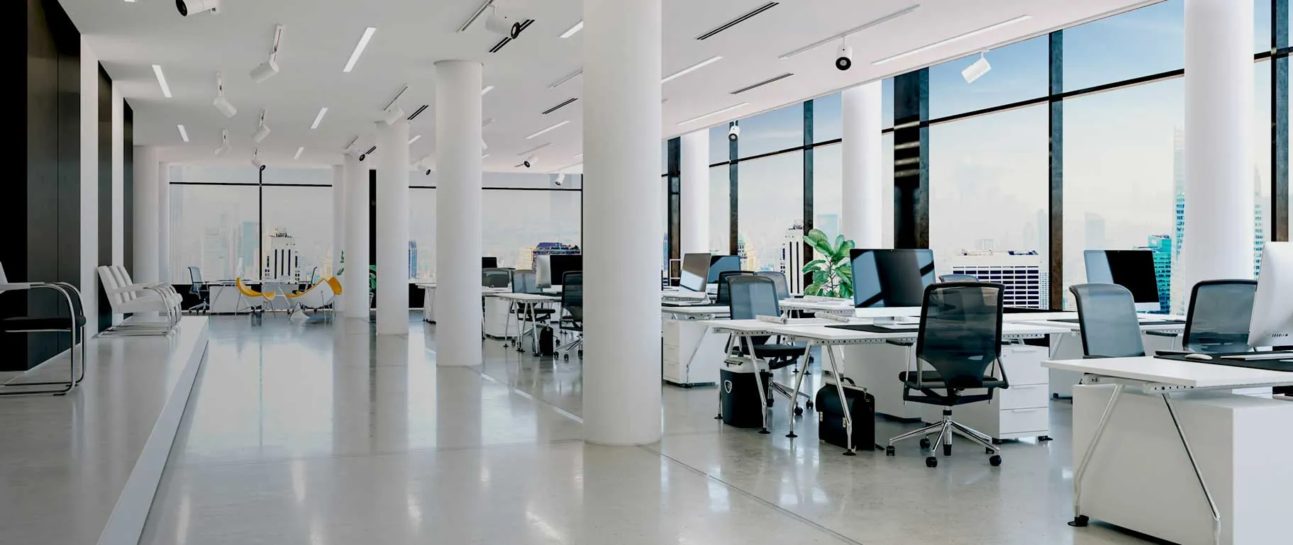 Bright open-plan office with clean desks, polished floors and floor-to-ceiling windows