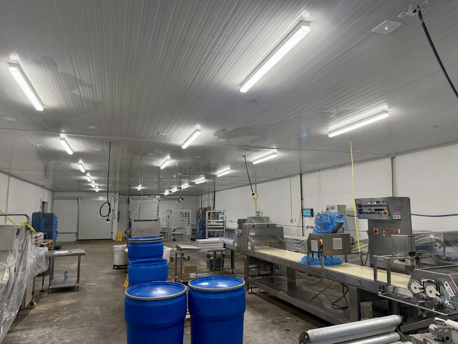 LDF Frozen Foods production floor after a Tidal Cleaning warehouse clean, with clean walls, ceiling panels and concrete floor