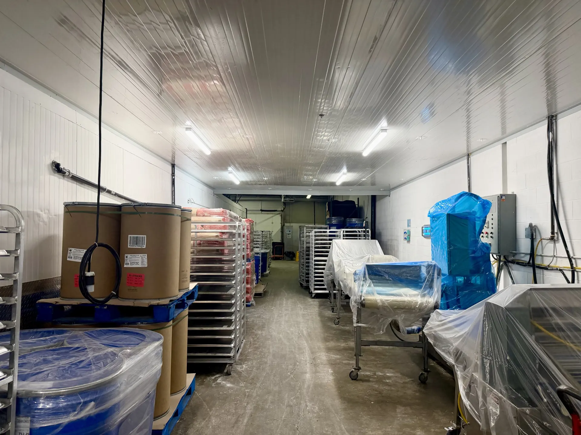 LDF Frozen Foods storage aisle with racks and cleared floor after a Tidal Cleaning warehouse clean