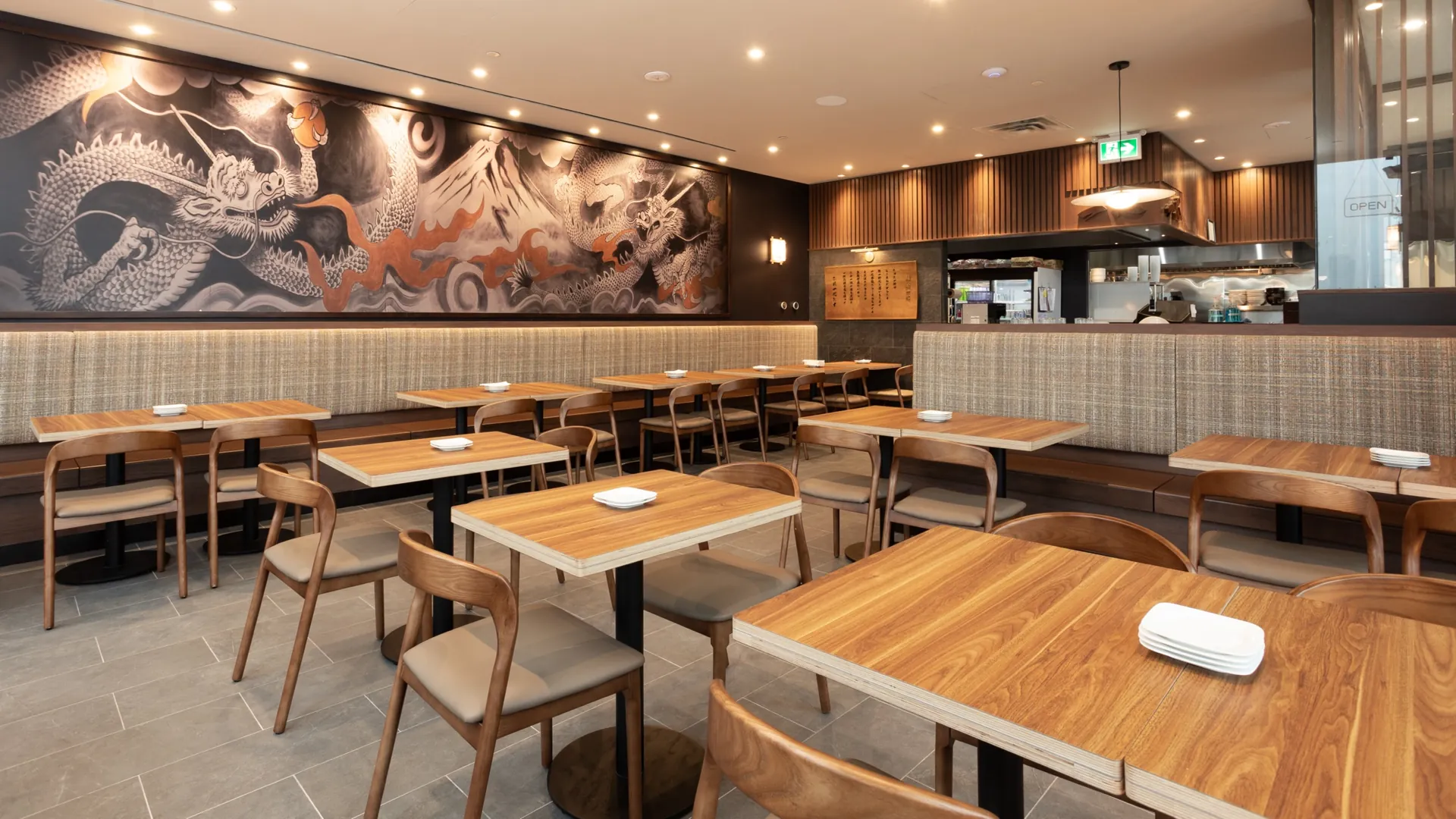Ramen Isshin dining room in Mississauga after a Tidal Cleaning monthly clean, with spotless tables, chairs and tile floor